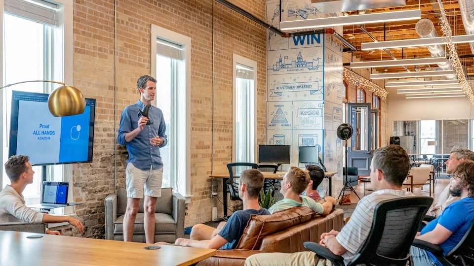 MSP founder team in modern office evaluating growth tooling