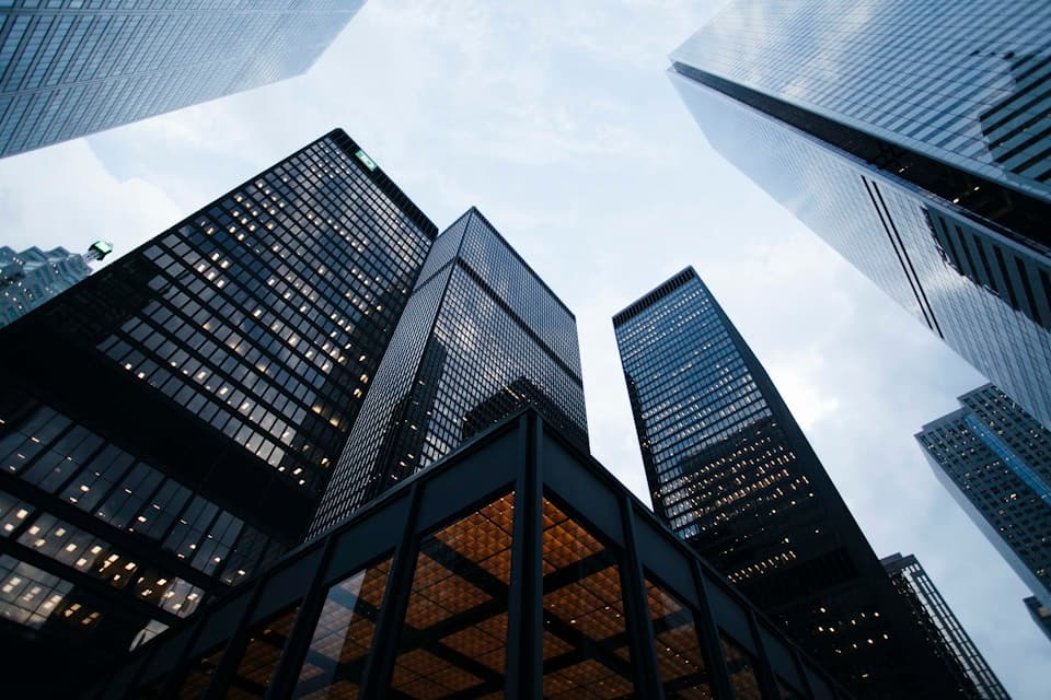 Financial services corporate towers representing regulated finance clients