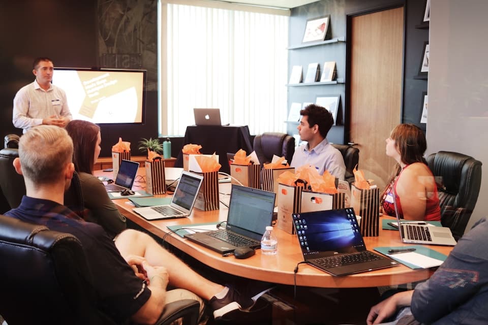 Leadership team in boardroom discussing MSP platform strategy